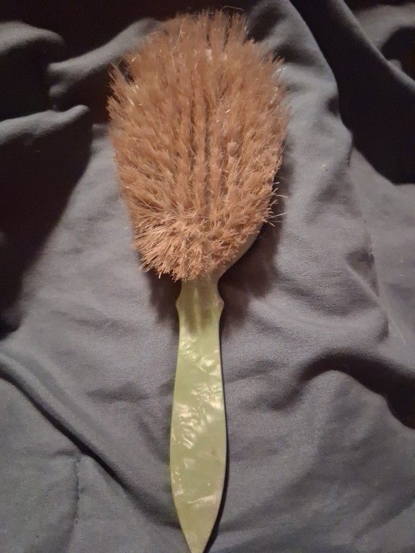 Vintage green hairbrush