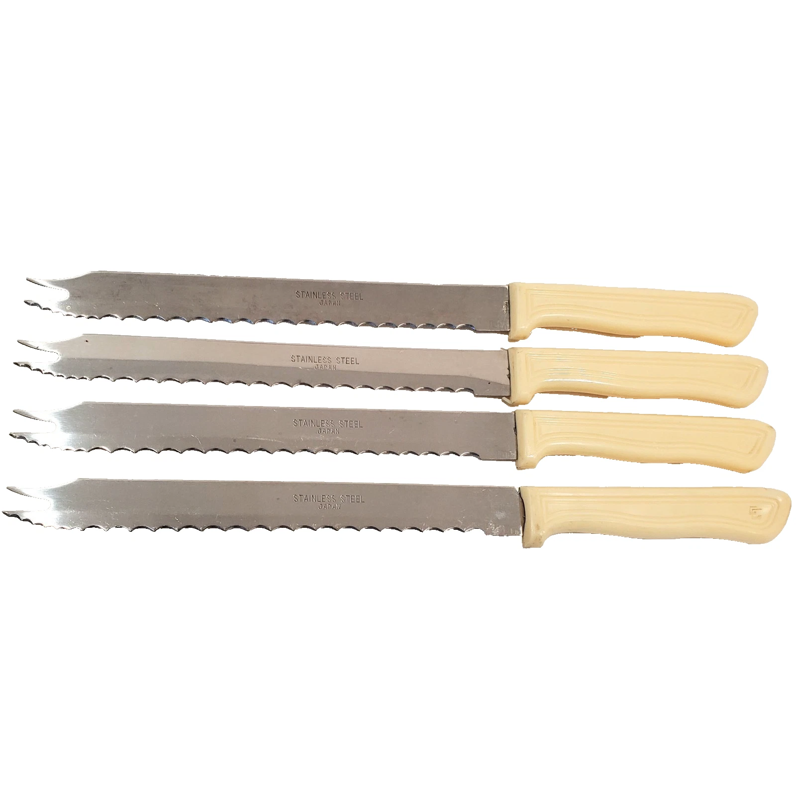 (4) vintage serrated slice & serve knives cream colored handle