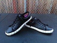 Stuart Weitzman Black leather Fringie rosette flower shaped midsole sneakers