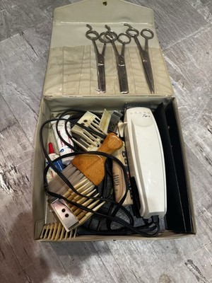 This vintage barber hair cutting kit appears to be a collectible set,