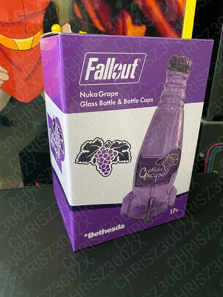 Fallout Nuka Cola Grape Purple Glass Bottle + 10 Caps Tin Rocket Statue Figure - Image 2 of 4