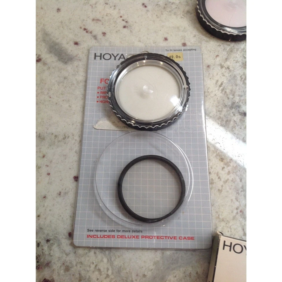 Lote de filtros de lente cuatro 55MM uno 52MM y otro 49MM Hoya Promaster y Yashica Foto 3 de 4