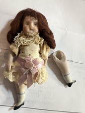 antique 4 inch tall german all bisque doll with damage..leg broken