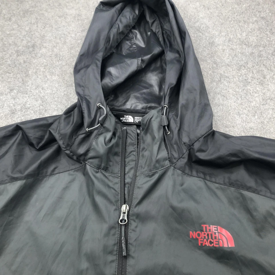 Chaqueta cortavientos The North Face para hombre grande negra cortavientos con capucha cremallera Foto 3 de 4