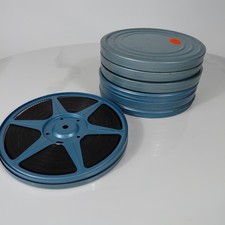 Lot of 7 vintage 8 mm film reels housed in matching blue metal cans