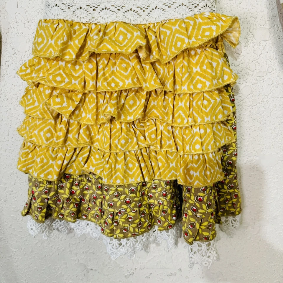 Vestido Delantal Manga Larga Estampado Mixto y Encaje Mostaza Pie Niña - Talla 3T Foto 4 de 4