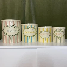 Vintage inspired hand painted kitchen nesting canisters. Set of 4