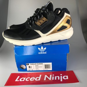 black and gold adidas tubular