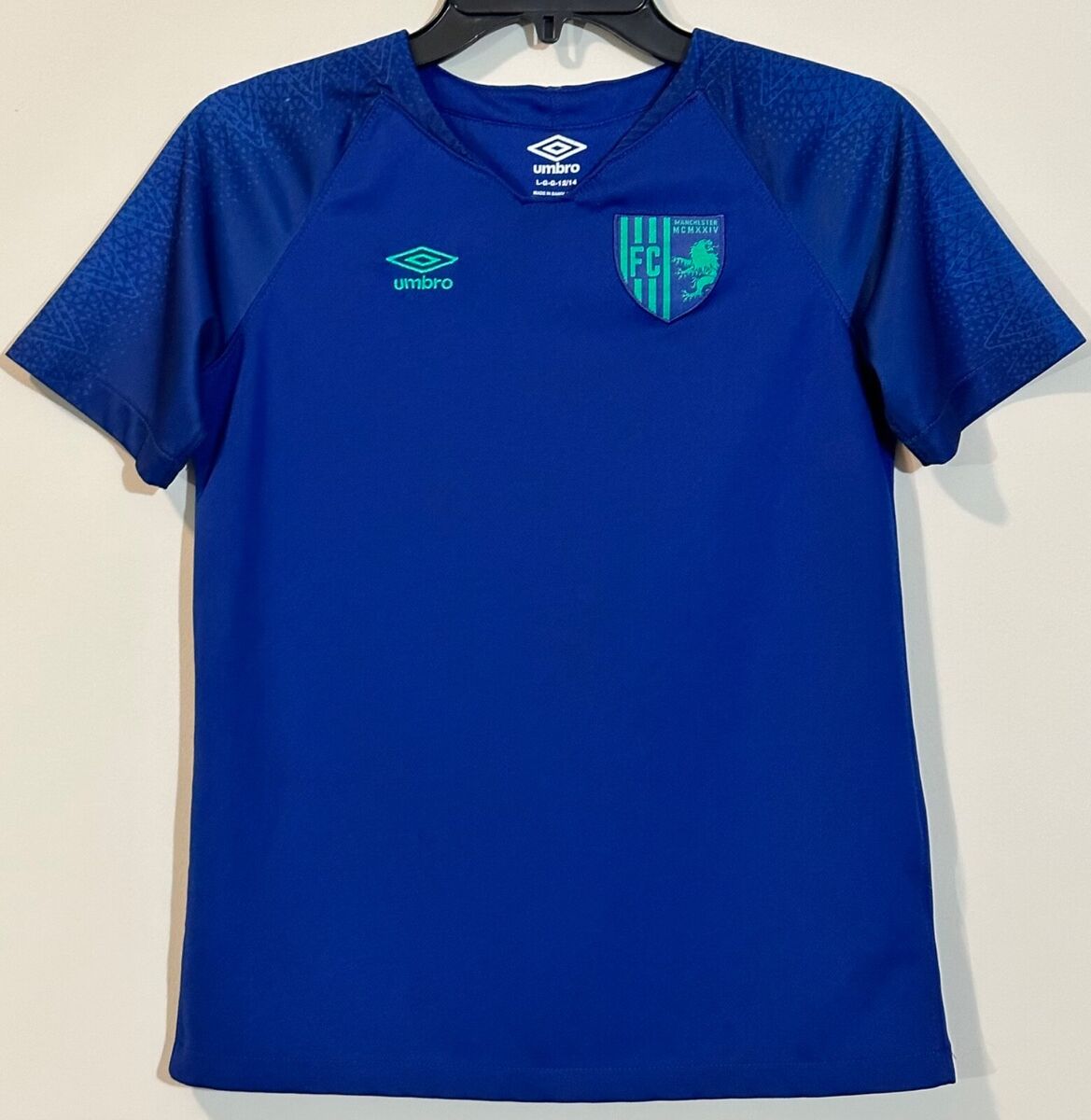 Umbro Manchester MCMXXIV FC Jersey Youth Large 12/14 Blue Umbro Manchester MCMXXIV FC Jersey Youth Large 12/14 Blue