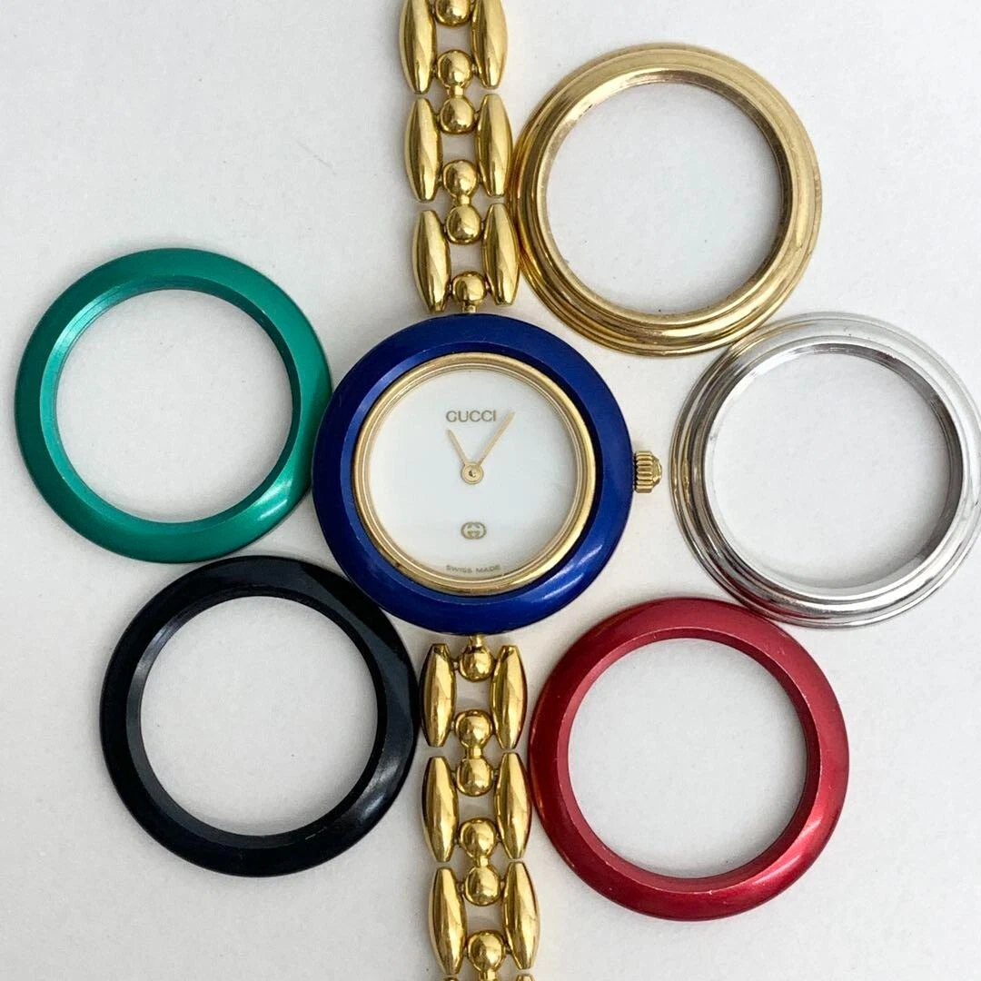 Gucci lunette à changement 11/12 bracelet quartz or 6 couleurs cadran blanc femme occasion