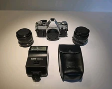 Near Mint - Canon AE-1 Film SLR Kit – 35 mm & 50 mm Lenses + Speedlite 188A