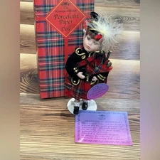 New w Imperf The Leonardo Collection "The Piper" w  Stand Porcelain Doll w Stand