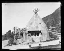 Concrete adobe home showing vases on ledge to left California Old Photo