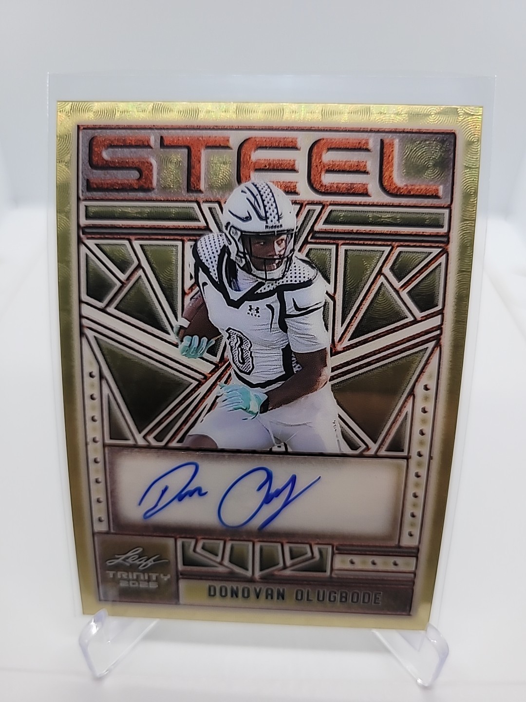 2025 Leaf Trinity Football Donovan Olugbode Auto 1/1 Steel Gold Prismatic