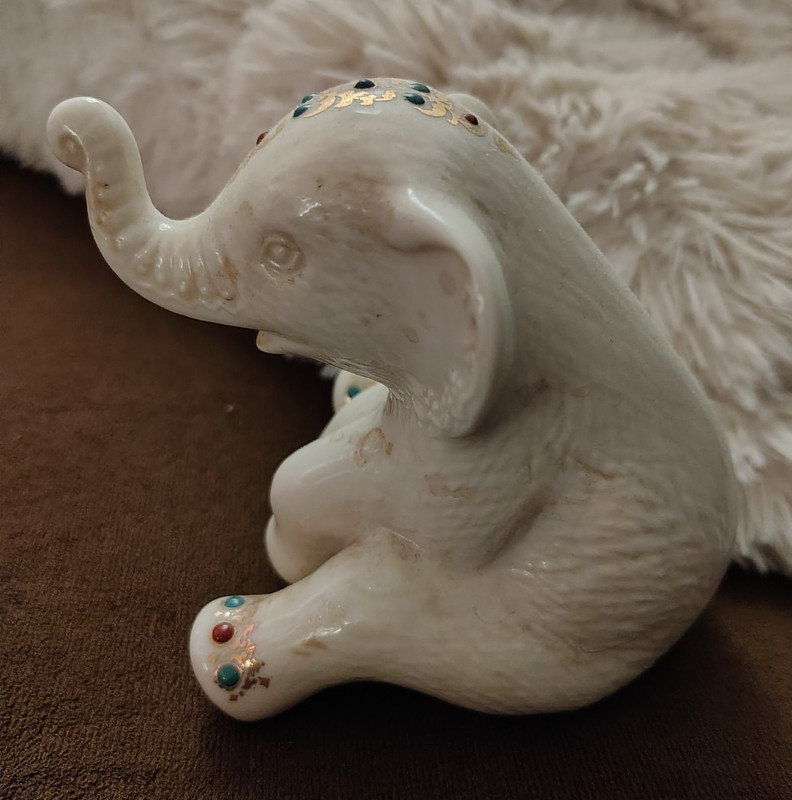 White Porcelain Elephant Figurine Seated Trunk Up, Floral & Jeweled Accents