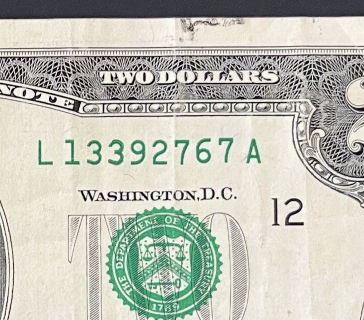 ERROR $2 DLL BILL - OVERINK ON SERIAL #: "3" & WET INK TRANFER ON MARGINS, CIRC.