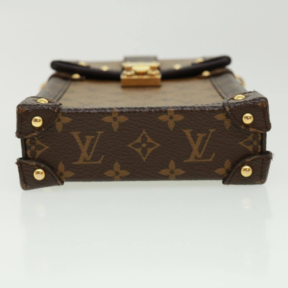 Shop Louis Vuitton Vertical trunk pochette (M67872, M67871) by lifeisfun