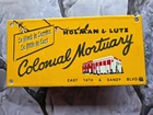 VINTAGE HOLMAN AND LUTZ COLONIAL MORTUARY PORCELAIN SIGN 10"×5"