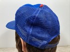 Blue mesh baseball trucker hat with red and white stripe, embroidered “VTG Chicago Cubs” text in white and blue on the back.