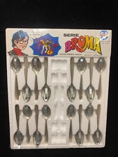 Display of  16   1978 Vintage Novelty Metal Exploding Spoons Banana for Scale