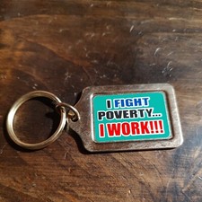 Vintage Funny Metal Keychain Made In USA. I Fight Poverty I Work!!