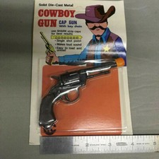 Vintage NOS Mini Toy Die Cast Metal Cowboy Cap Gun in sealed Package