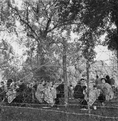 Visitors enjoy afternoon tea surrounded by barbed wire outdoor - 1942 Old Photo