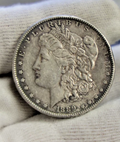 1889  US Morgan Silver Dollar $1 XF (Rim Nick)
