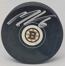 Mason Lohrei BOSTON BRUINS Auto hockey Puck SIGNED NHL AUTOGRAPH DEFENSEMAN 