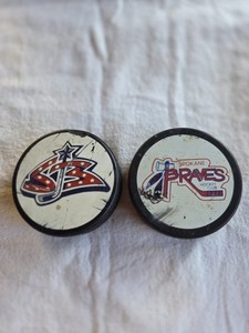 2 Spokane Braves Hockey Pucks, Old and New Logos, Junior B Team