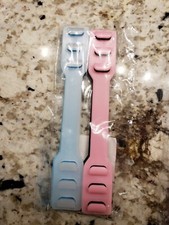 Nieotwarte opakowanie czterech uchwytów na paski maski