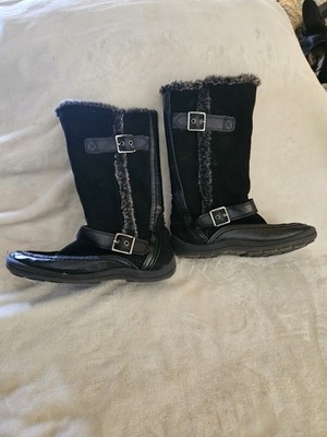 Nine West Naydine mid-calf boots in black suede with faux fur lining.