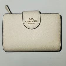 COACH Medium Leather Corner Zip Wallet. Ivory is the color. From Neiman Marcus