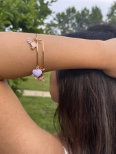Gold Toned Stainless Steel Expandable Bangle With Pink & Purple Themed Charms
