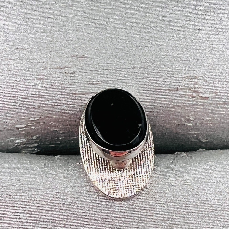 A sleek vintage silver-and-black-onyx tie tack is the kind of understated Mad Men detail that elevates a suit instantly — and at under $20 it's a no-brainer gift.
