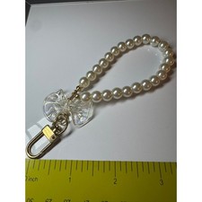 Faux Pearl Wristlet Keychain with Iridescent Bow Charm Gold Tone Hardware Cream