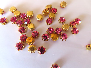 72 Swarovski Rhinestones 29ss Rose/ brass star settings.