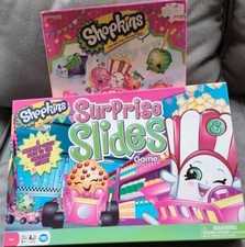 Shopkins Juegos, Lote de 2- Juego de Mesa de Diapositivas Sorpresa y Supermercado Scramble Game
