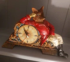 A vintage desk or mantle clock of foxhunting interest featuring Sir Reynard fox.