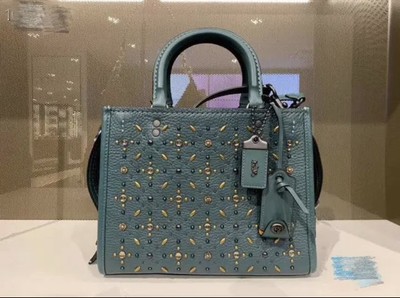 coach rogue with rivets