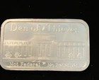 Den of Thieves 1oz .999 Silver Shield Bar Not Federal & NO Reserves in Capsule A
