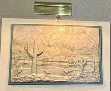M Hartman 3-D relief sculpture of a desert landscape. Framed w/mounted light