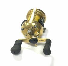 Shimano Calcutta 400 multiplier sea reel with gold finish plus optional check