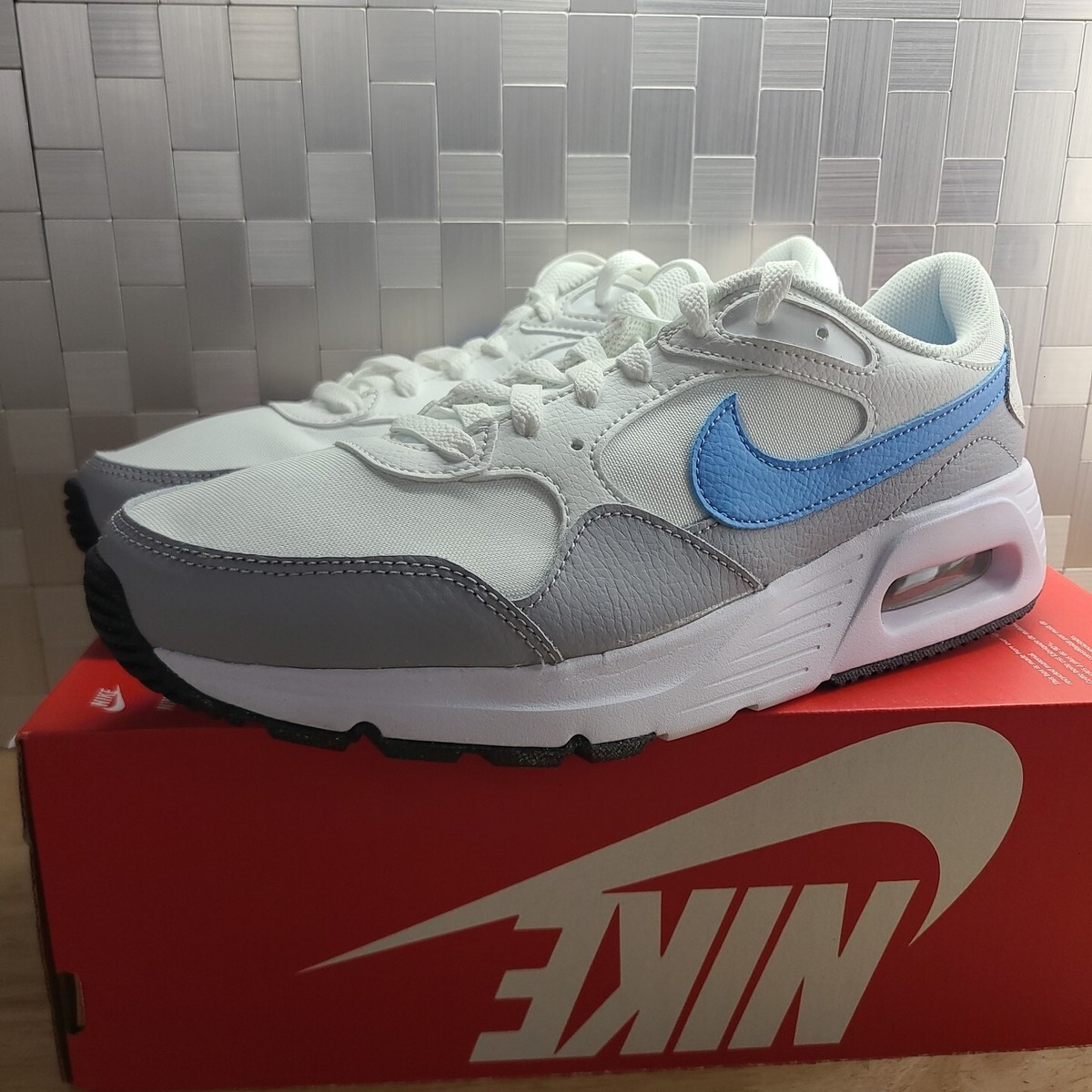 white & blue air max sc trainers