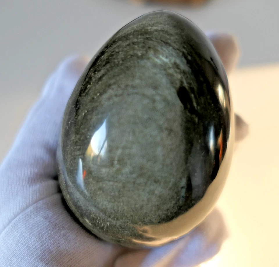 Gros oeuf en pierre polie obsidienne argentée dorée 8 cm - Photo 2/4
