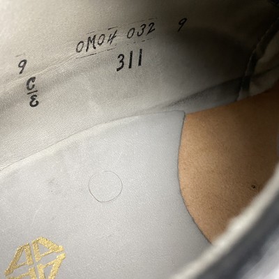 Alden 311 Plain Toe Dover is built on the CDI last. The model has a black Shrunken Calf leather upper with a wedge outsole.