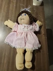 New ListingVintage 1984 Cabbage Patch Boy Doll. Brown Hair Pink Dress