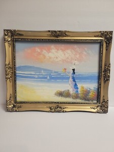 Original painting, lady by the ocean. Frame with picture 18 3/4 X 14 1/2.