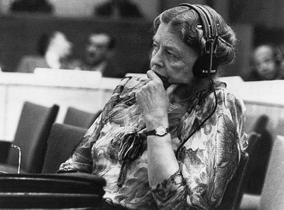 Eleanor Roosevelt sits with headphones during a speech at United Na- Old Photo