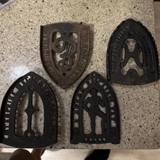 4 Vintage Cast Iron And Brass Sad Iron Trivets—WH Howell, Enterprise, Etc